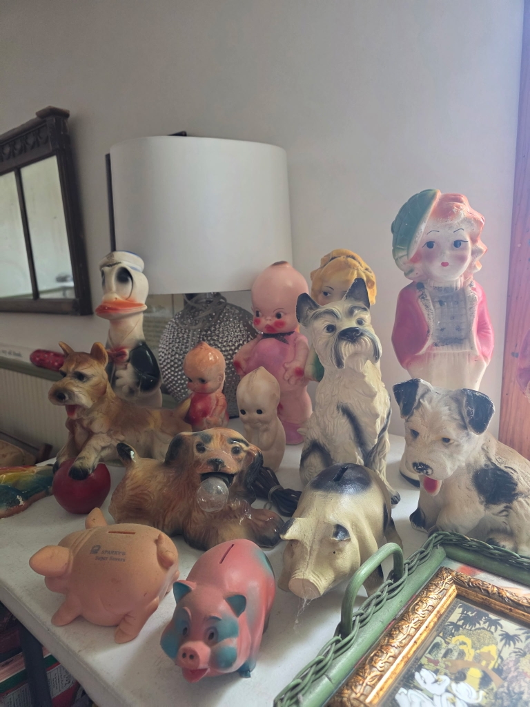 Collection of vintage animal figurines arranged for an estate sale