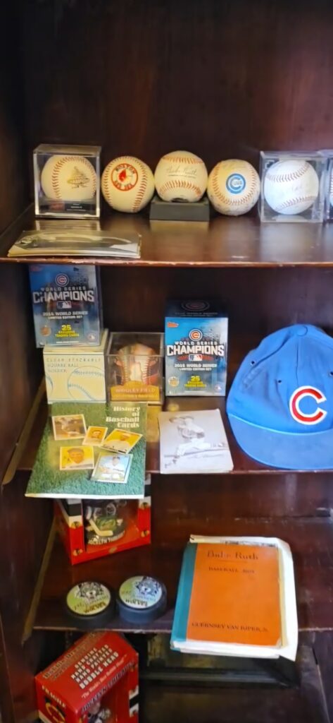 Vintage collectibles and memorabilia displayed on wooden shelves
